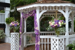 purple peach wedding.founders hall.flowers by holland.altar